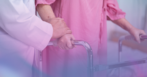 woman using walker post hip replacement recovery