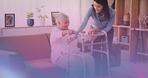 Caregiver helping a woman after knee surgery